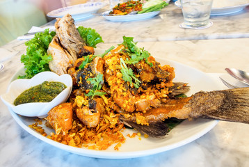 deep fried sea bass with garlic and spicy Thai sauce
