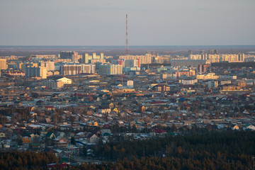 Obraz premium Yakutsk city midtown aerial view from hill at amazing sunset. View from the hill on the city
