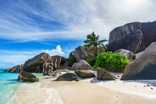 rocks,white sand,palms,turquoise water at tropical beach,la dique,seychelles paradise 3