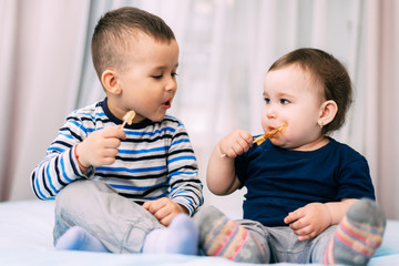 Brother and sister eat lollipops in the form of a cock