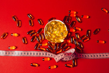 medicines spilled on a red background
