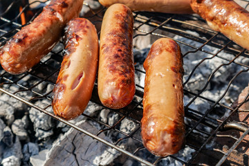 grilled sausages on grill close up