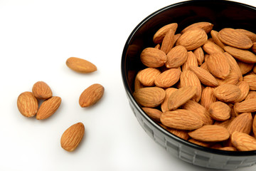 Healthy Almond Seeds in a bowl on white background