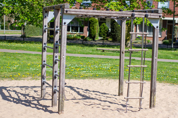Fototapeta na wymiar Climbing frame in playground for children in a public park