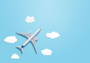 Small airplane model on the blue background with copy space