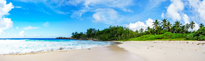 Fototapeta na wymiar panorama of tropical beach.palms,granite rocks and turquoise water,seychelles 2