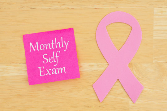 Monthly self exam reminder with pink cancer ribbon