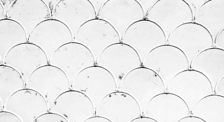 fish scale pattern on white iron grate © nucia