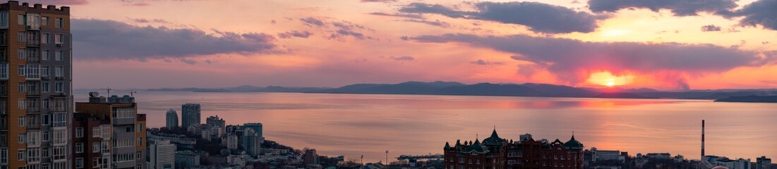 Fototapeta na wymiar Panoramic view of the city of Vladivostok against the sunset.