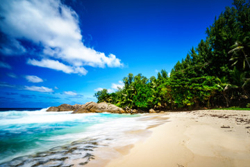 beautiful tropical beach with palms,granite rocks and turquoise water, seychelles 2