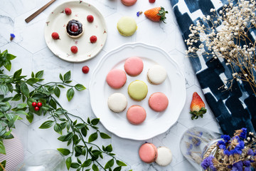 Macaron or French macaroon cookies dessert. Set on cafe table.