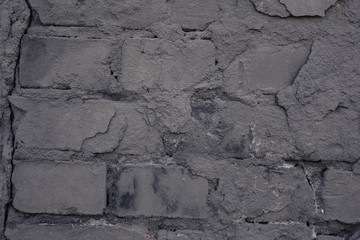 Old black wall. Brick background. Grunge.