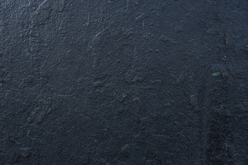 texturally painted old dark grey wall