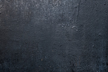 texturally painted old dark grey wall