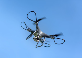 Drone in the sky. Unmanned aerial vehicle flying in the air.