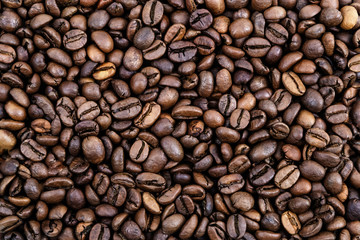 Coffee grains. Background of roasted coffee beans brown. layout. Flat lay.