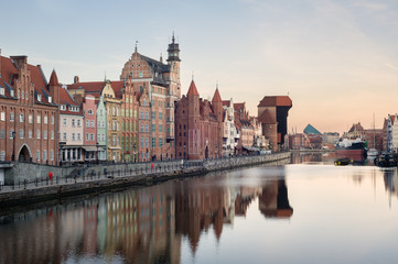 Fototapeta na wymiar Old town of Gdansk in the early morning: an embankment and famous crane Zurav.