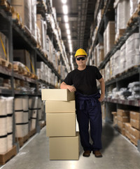 Worker in Mechanic Jumpsuit with holding parcel boxes