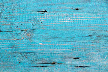 The texture of the wooden board, covered with old blue paint. Vintage background and wallpaper with space for text or image.  © Sham-ann