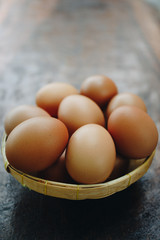 Fresh brown eggs in the basket, Pile of raw chicken egg