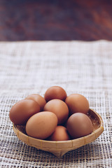 Fresh brown eggs in the basket, Pile of raw chicken egg