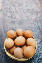 Fresh brown eggs in the basket, Pile of raw chicken egg