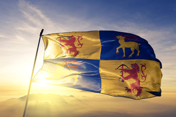 Kalmar county of Sweden flag waving on the top sunrise mist fog