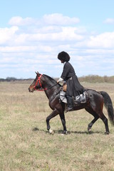 Race horses and riders on them.