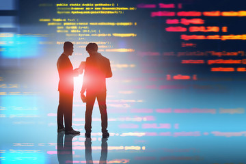 People discussing code. Technological startup