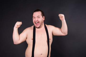 Funny fat man. Black background.