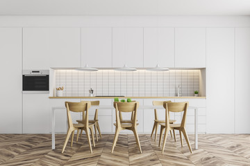 White kitchen with counters and table