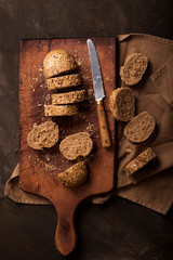 Sliced traditional bread and on a dark table