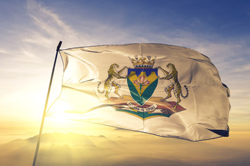 Free State province of South Africa flag waving on the top sunrise mist fog