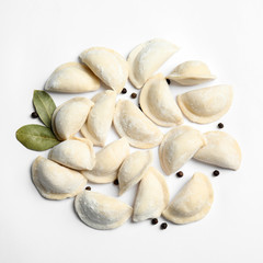 Raw dumplings on white background, top view. Home cooking