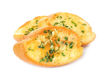 Slices of tasty garlic bread with herbs isolated on white