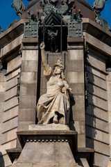 statue with church and sky background
