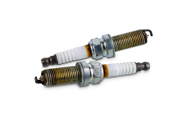 Car spark plugs that have been used for more than 10,000 kilometers isolated on white