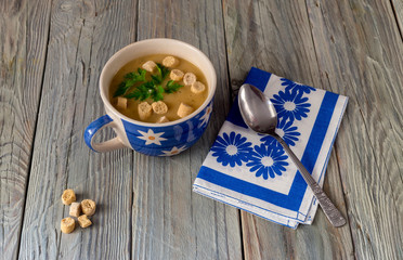 Pea soup in a blue bowl close-up