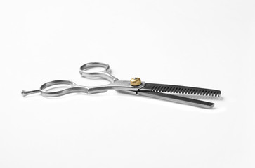 New thinning scissors on white background. Professional hairdresser tool