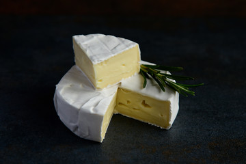 Cheese camembert or brie with fresh rosemary