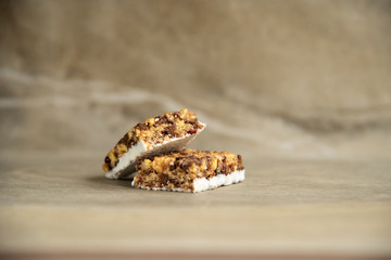 Muesli and cereal bar on marble stone background