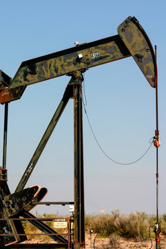 Oil derrick at work. Hobbs, New Mexico