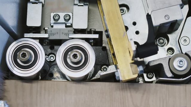 Single sided automatic edge bander on factory. Close-up