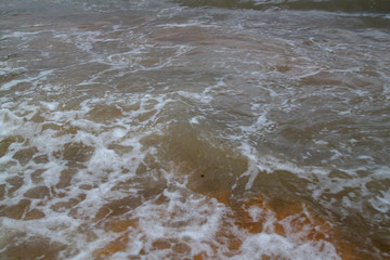 The bubble wave in sea on sand for background