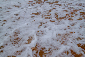 The bubble wave in sea on sand for background