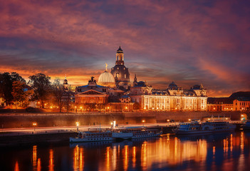 Fototapeta na wymiar Amazing colorful scene during sunset at the Old Town in Dresden, Saxony, Germany. Famouse Sights: Frauenkirche, Hofkirche, Semperoper with reflected in water. wonderful picturesque scenery. Postcard