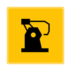 robotic arm on yellow signage