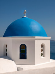 Fototapeta na wymiar The dome of a Greek Orthodox Church on the Island of Santorini Greece. 