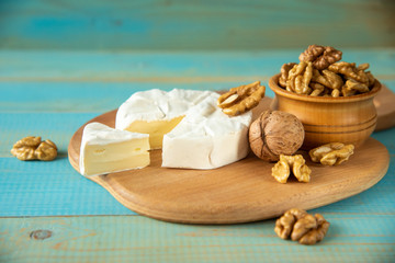 Cheese camembert or brie with walnut kernels