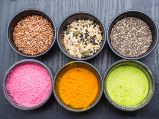 Obraz na płótnie Canvas different superfood powders, seeds, detox concept